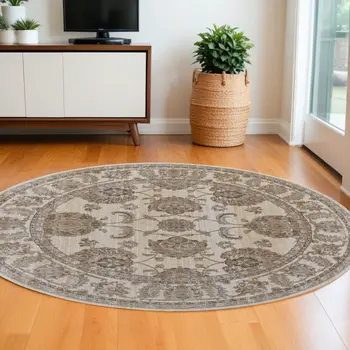 8' Brown and Ivory Round Oriental Power Loom Distressed Area Rug