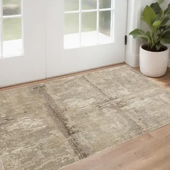 2' X 3' Tan Ivory And Brown Abstract Area Rug