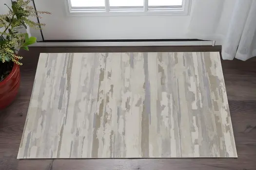 2' X 3' Brown Ivory And Tan Abstract Distressed Area Rug