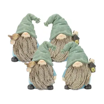 Set of Four Blue and Green Polyresin Christmas Figurine Tabletop Sculpture