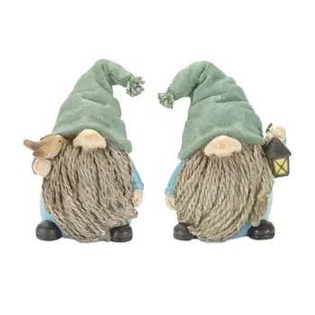 Set of Four Blue and Green Polyresin Christmas Figurine Tabletop Sculpture