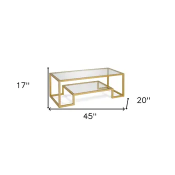 45" Clear And Gold Glass And Steel Sled Coffee Table With Shelf