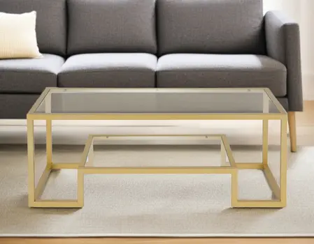 45" Clear And Gold Glass And Steel Sled Coffee Table With Shelf