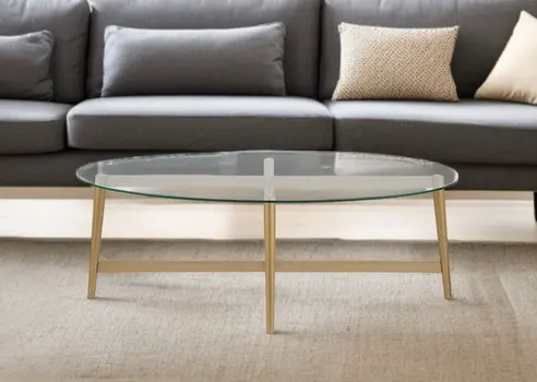 50" Clear And Gold Glass And Steel Oval Coffee Table