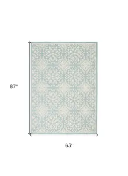 5' X 7' Blue and Ivory Floral Medallion Power Loom Area Rug