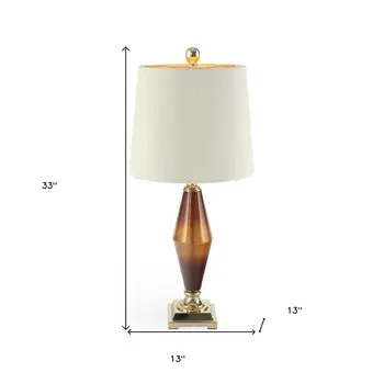 33" Gold and Brown Glass Table Lamp With Beige Cone Shade