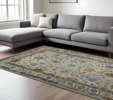 8' X 11' Orange and Ivory Floral Power Loom Area Rug