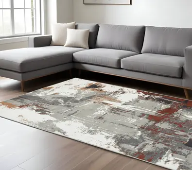 6' X 9' Ivory Gray and Rust Abstract Power Loom Area Rug