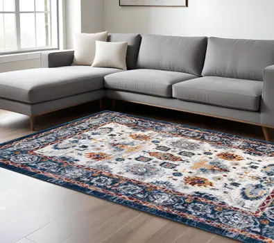 9' X 12' Ivory Navy and Orange Floral Power Loom Area Rug