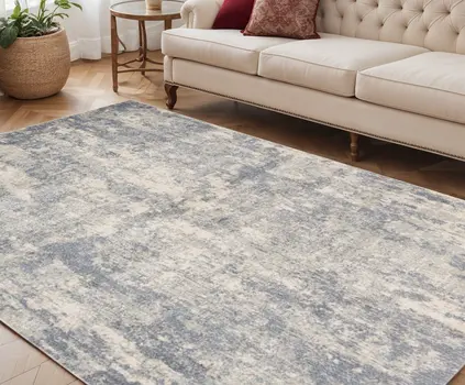 5' X 8' Light Gray Blue And Ivory Abstract Area Rug