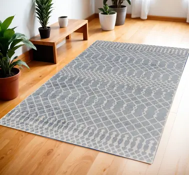 4' X 6' Blue and Ivory Abstract Power Loom Washable Area Rug