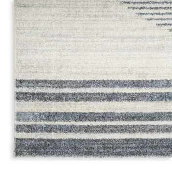 5' X 7' Blue And Ivory Geometric Washable Area Rug