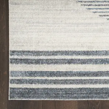 7' X 9' Blue And Ivory Geometric Washable Area Rug