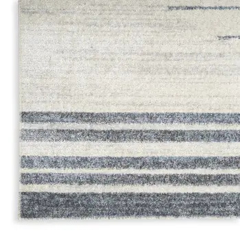 7' X 9' Blue And Ivory Geometric Washable Area Rug