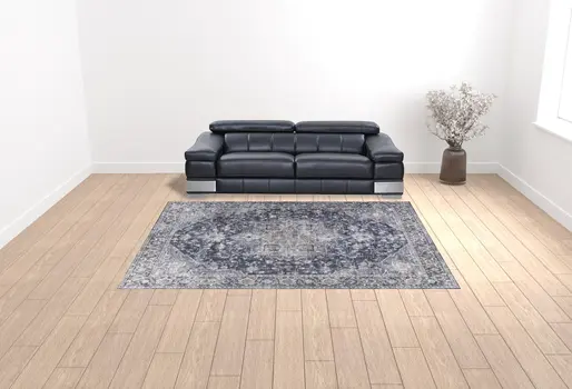 9' X 12' Blue and Ivory Floral Power Loom Distressed Washable Area Rug