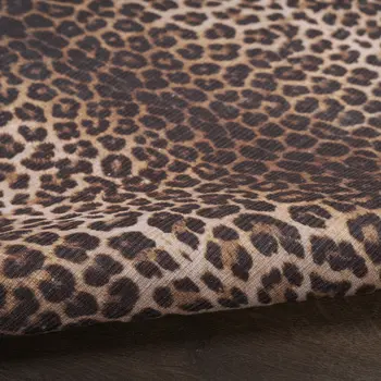 5' X 7' Brown and Ivory Leopard Print Power Loom Washable Non Skid Area Rug