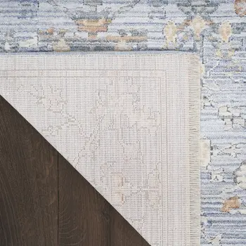 5' X 8' Blue and Ivory Oriental Power Loom Distressed Area Rug With Fringe
