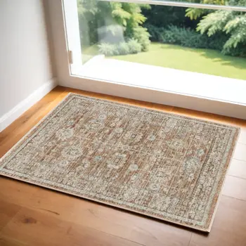 3' X 5' Orange and Ivory Oriental Power Loom Distressed Area Rug With Fringe