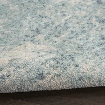 5' X 7' Blue and Ivory Abstract Power Loom Washable Area Rug