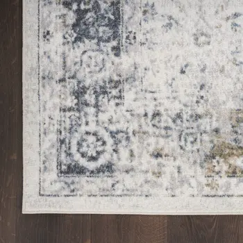 8' X 10' Blue and Ivory Floral Medallion Power Loom Distressed Washable Area Rug