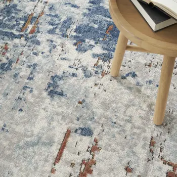 5' X 7' Beige and Blue Abstract Power Loom Area Rug