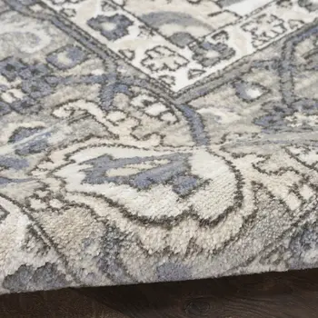 5' X 7' Blue and Ivory Medallion Power Loom Distressed Area Rug