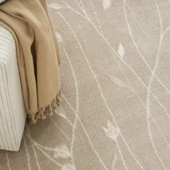5' X 7' Beige and Ivory Floral Power Loom Area Rug