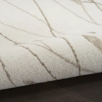 8' X 10' Beige and Ivory Floral Power Loom Area Rug