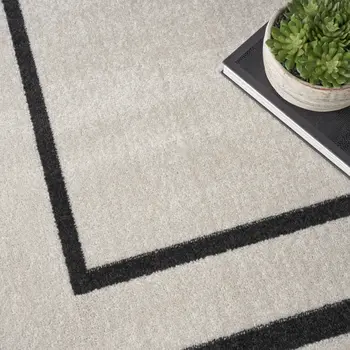 9' X 12' Ivory And Black Indoor Outdoor Area Rug