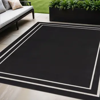 5' X 7' Black And Ivory Indoor Outdoor Area Rug
