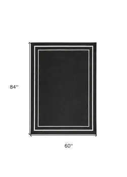 5' X 7' Black And Ivory Indoor Outdoor Area Rug