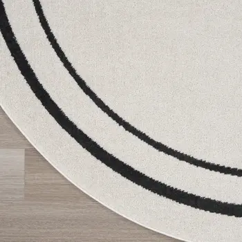 8' Ivory And Black Round Indoor Outdoor Area Rug