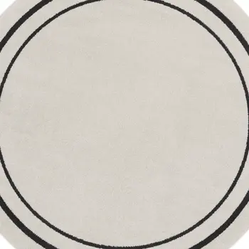 8' Ivory And Black Round Indoor Outdoor Area Rug