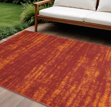 6' X 9' Red And Orange Abstract Indoor Outdoor Area Rug