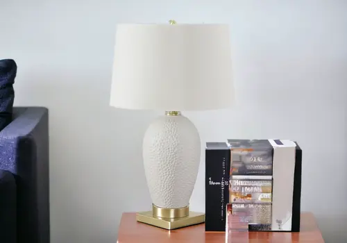 26" Gold and White Ceramic Urn Table Lamp With Cream Empire Shade