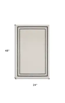 2' X 4' Ivory And Black Indoor Outdoor Area Rug