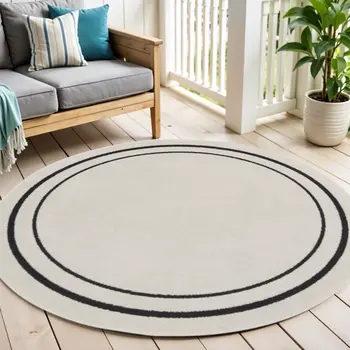 4' Ivory And Black Round Indoor Outdoor Area Rug