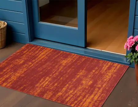 2' X 4' Red And Orange Abstract Indoor Outdoor Area Rug