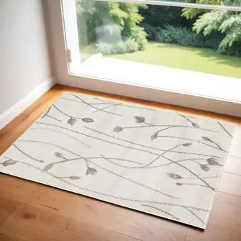 2' X 4' Beige and Ivory Floral Power Loom Area Rug