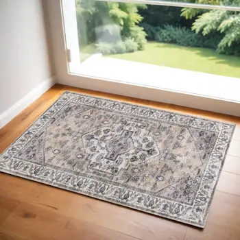 2' X 4' Beige and Ivory Medallion Power Loom Distressed Washable Non Skid Area Rug