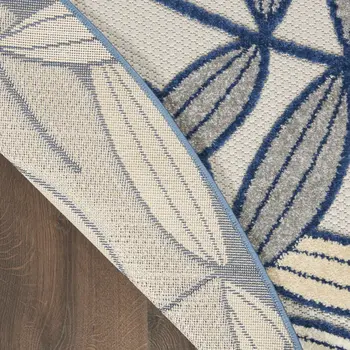 4' Navy Blue And Ivory Round Botanical Leaves Indoor Outdoor Area Rug