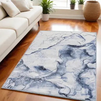 5' X 7' Ivory and Blue Abstract Power Loom Area Rug