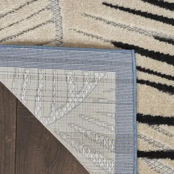 5' X 7' Navy Blue Ivory And Black Palm Leaf Indoor Outdoor Area Rug
