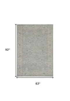 5' X 8' Beige and Blue Floral Power Loom Area Rug