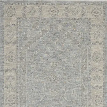 5' X 8' Beige and Blue Floral Power Loom Area Rug