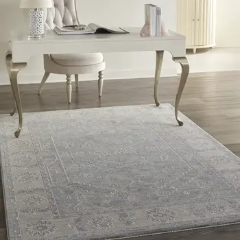 5' X 8' Beige and Blue Floral Power Loom Area Rug