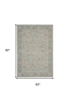 5' X 8' Beige and Gray Floral Power Loom Area Rug