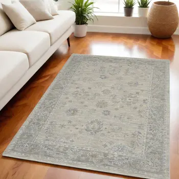 5' X 8' Beige and Gray Floral Power Loom Area Rug