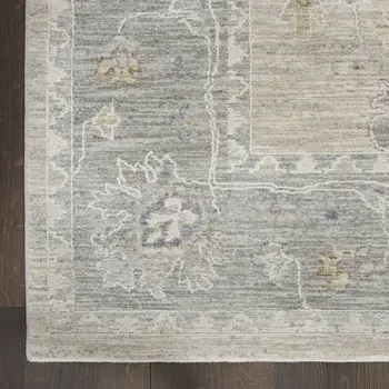5' X 8' Beige and Gray Floral Power Loom Area Rug