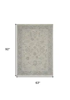 5' X 8' Beige and Gray Floral Power Loom Area Rug